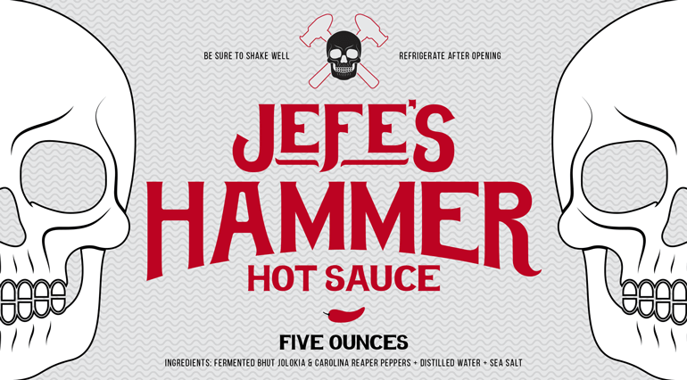 jefes-hammer-label-B Sauce bottle grey label with red logo text centered, and white skull halves on the left and right