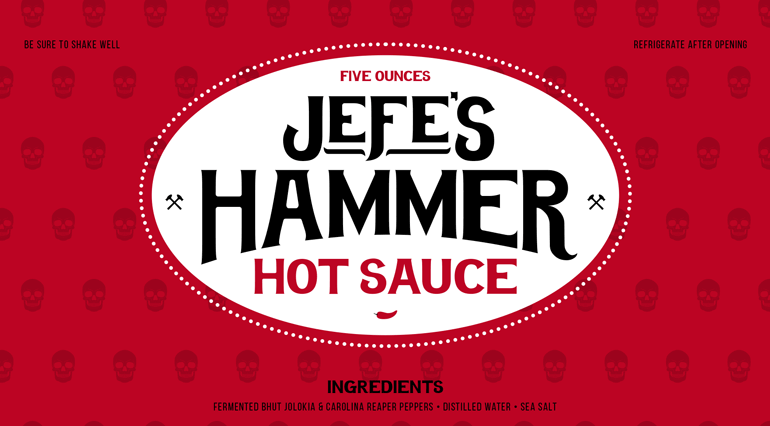 jefes-hammer-label-C Sauce bottle red label with bespoke skull pattern in background and large black logo text sitting inside white circle in center