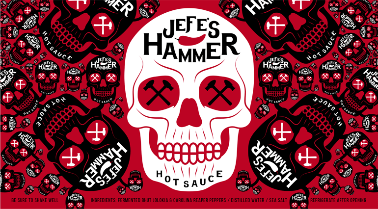 jefes-hammer-label-G Sauce bottle red label with white skull design in the middle and smaller versions/orientations of the skulls in black on either side