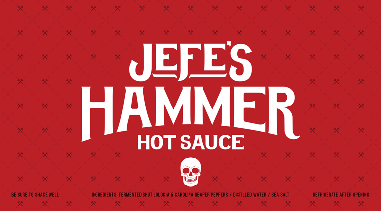 jefes-hammer-label-K Sauce bottle red label with bespoke hammer pattern in background and large white logo text in center